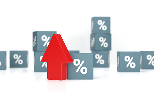 Cubes with percent sign and arrow pointing down. Economy And Finance Concept.