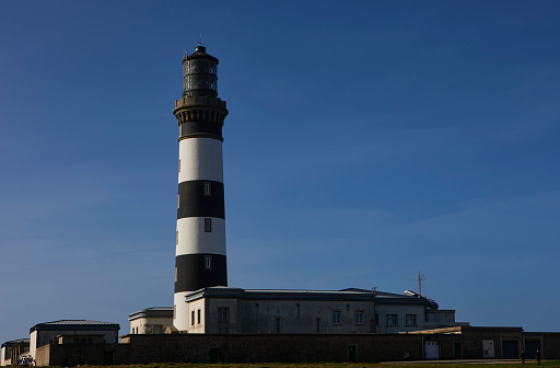 France, Brittany, Ile d'Ouessant, west rocky coast and Creac'h lighthouse