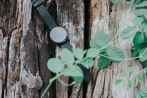 Black Smart watch on a wooden. Modern technologies. New model of smart watches.