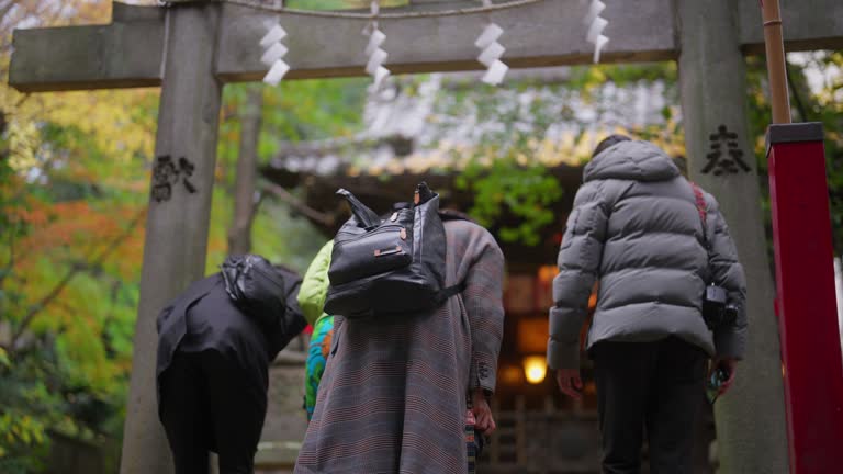 Group of multiracial friends visiting shrine during their travel