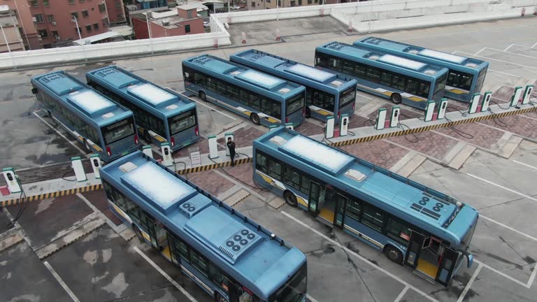 The driver is charging the electric bus