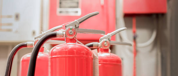 istock The red fire extinguisher is ready for use in case of an indoor fire emergency. 1447301307