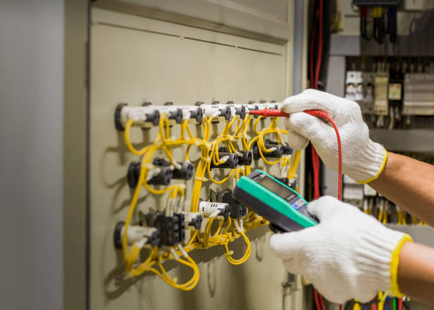 istock An electrical engineer is inspecting the operation of an electrical control cabinet. maintenance concept 1447301311