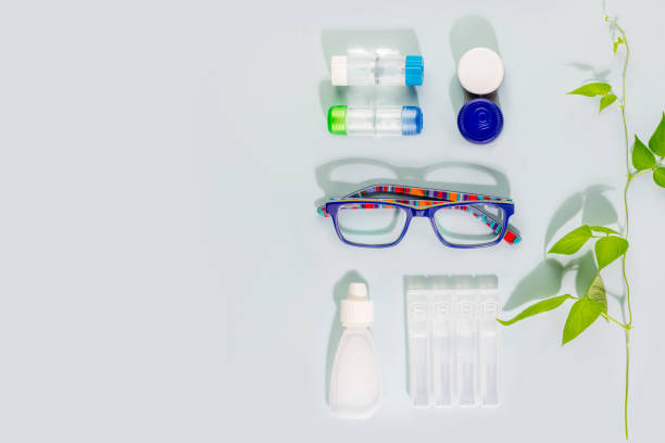 istock Eyeglasses, containers with contact lenses, eye drops and copy space 1447302667