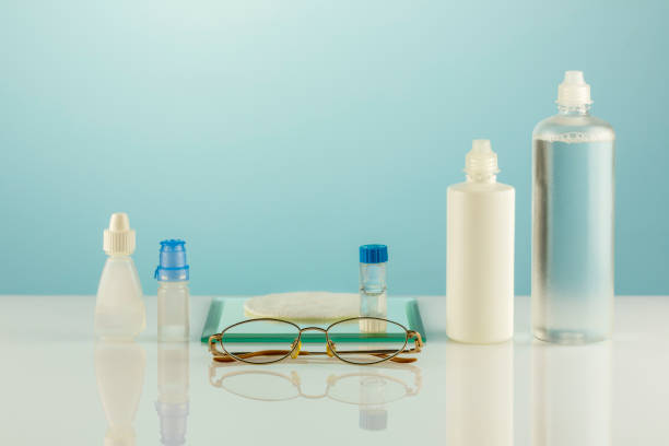 istock Oftalmology concept with eyeglasses, contact lenses, eye drops, clean solutions 1447302673