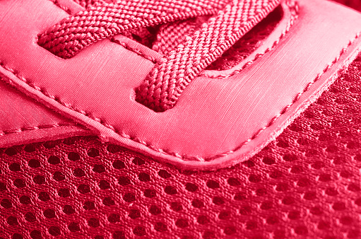A fragment of a viva magenta sneaker. Close-up