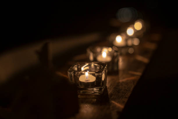istock row of candles in the dark 1447305084