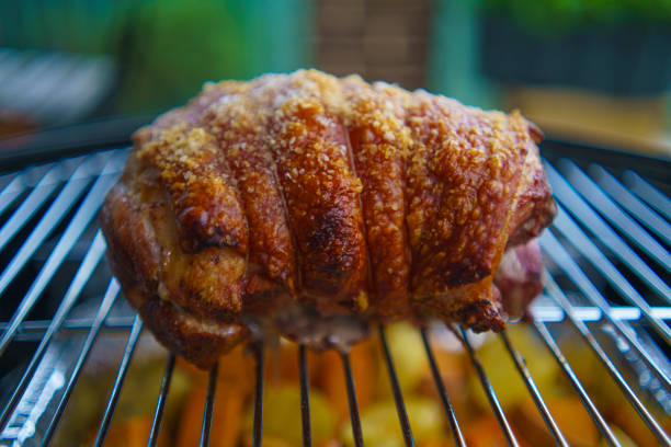 pork knee on a wooden board,smoked and festering pig's knee,copy space
