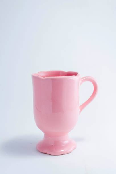 istock Vertical shot of a pink mug isolated on a white background 1447308939
