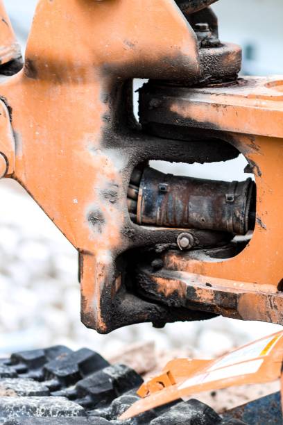 istock Vertical shot of a rusty old steel joint - construction machine boom part 1447309155