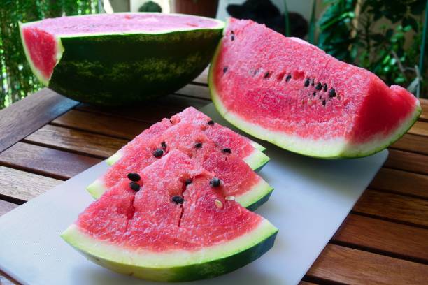 istock ripe sweet red watermelon cut into slices and triangles 1447311409