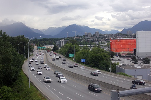 Vancouver, Canada – June 11, 2022: The Trans Canada highway with mountains in the background in Vancouver, British Columbia, Canada