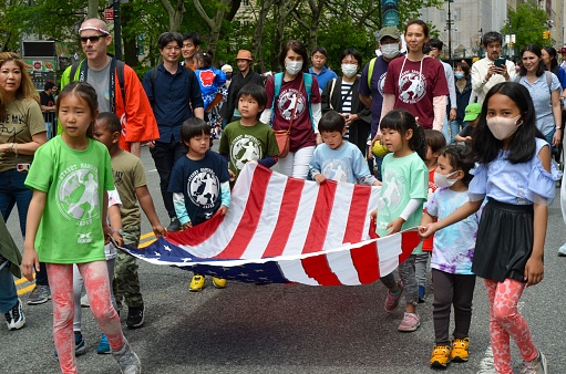 New York, United States – May 14, 2022: Cheerful kids and parents attending the first ever annual Japanese day Parade in New York City