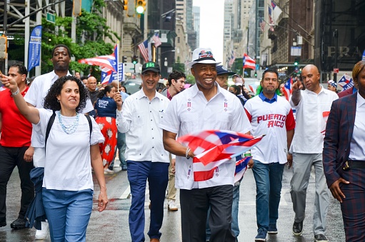 New York, United States – June 12, 2022: The historic 65th annual Puerto Rican Day Parade in New York City with a crowd of people watching