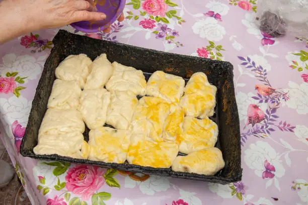 making branzoici , Romanian homemade crullers, cheeses with raisins , Branzoici traditional recipe from Bistrita or Moldavian Branzoaice (Poale-n brau)