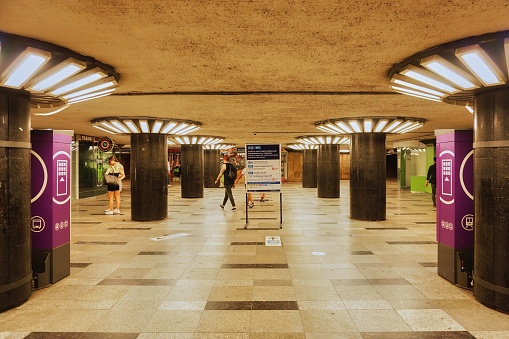Budapest, Hungary – June 23, 2022: A symmetric shot of a crowded underground passway