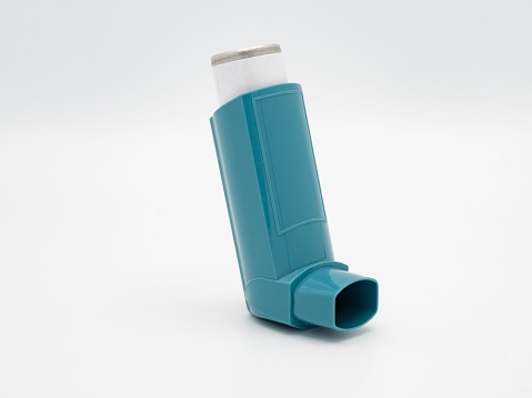 An asthma inhaler isolated on a white background