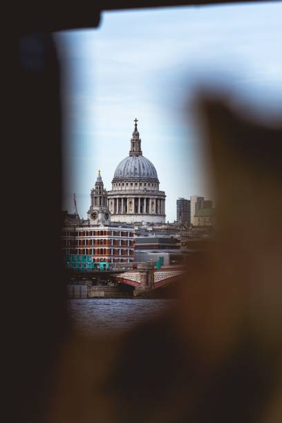 St. Paul's Cathedral across Millennium Bridge and the River Thames in London, UK.