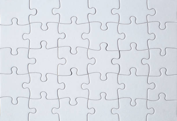 istock Full-frame photograph of a white jigsaw puzzle 1447316695