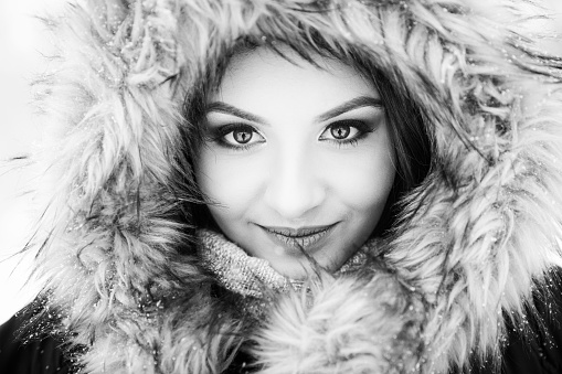 A portrait of a young caucasian woman in a winter jacket