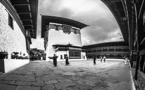 Royal court of Justice in Bhutan, a school for Buddhist monk paro, Bhutan – August 25, 2017: The Royal court of Justice in Bhutan, a school for Buddhist monk black and white travel travel destinations monk stock pictures, royalty-free photos & images