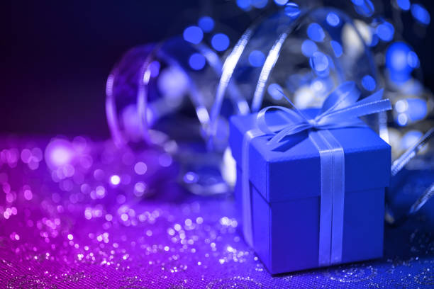 Blue gift bag with bow on white