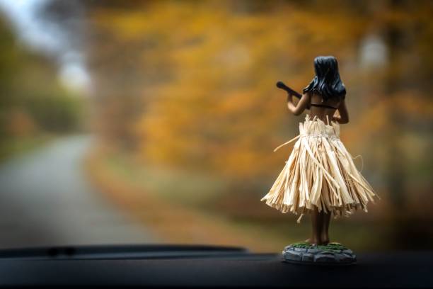 istock Miniature Hawaiian statuette in the car 1447319515