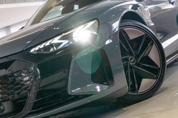 Belo Horizonte, Brazil – November 02, 2022: A black Audi RS E-Tron GT in the showroom with illuminated headlights