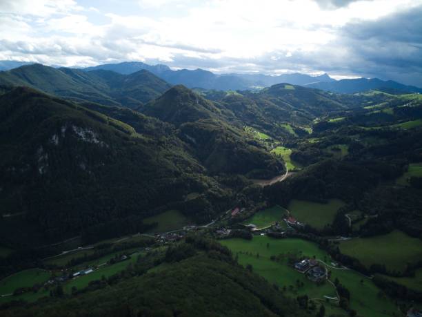 istock Drone shot of mountains covered in trees in Austria 1447321179