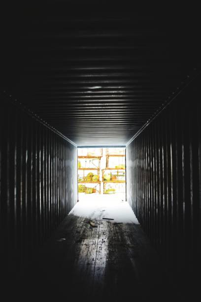 istock Vertical shot of the interior of a container with light visible on the end 1447321597