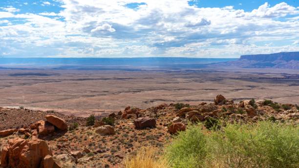 istock Red rocky hill on a sunny day with a cloudy blue sky 1447322846