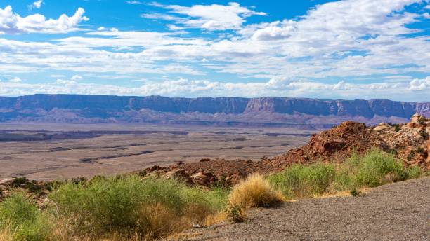 istock Red rocky hill on a sunny day with a cloudy blue sky 1447322852