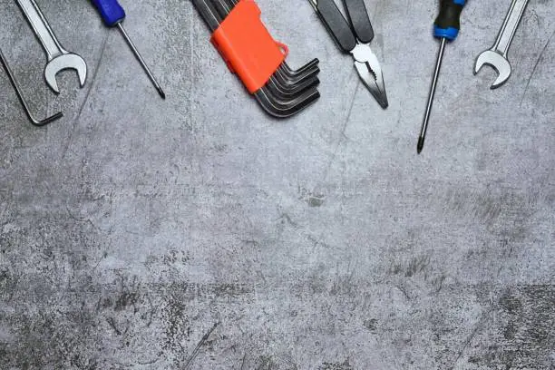 An assortment of tools and variety isolated on a stonebackground