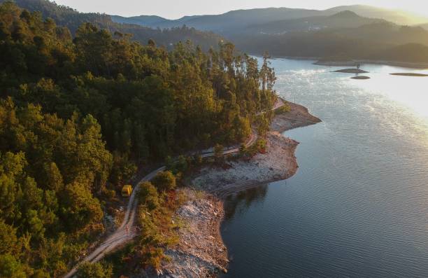 istock Aerial view of forested mountains on the shore 1447326055