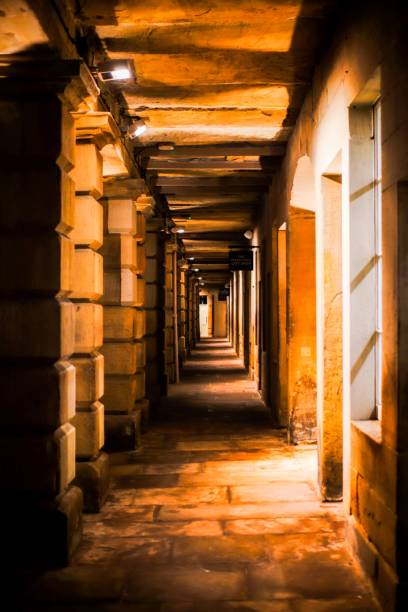 istock Vertical of a corridor with old walls at night 1447329256