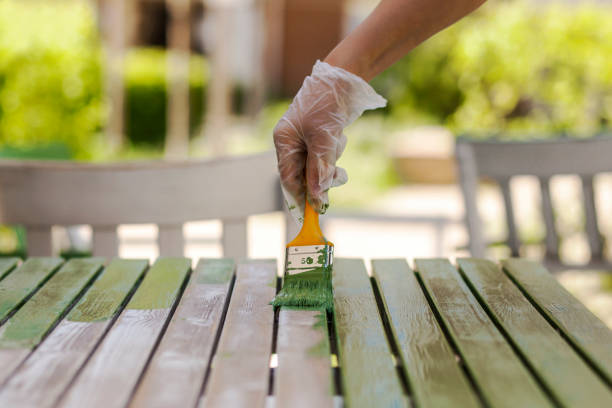 istock Painting table in protective gloves 1447329988