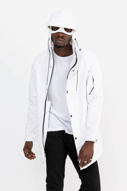 istock Black male model wears a denim jacket and is in front of a white background. 1447330077