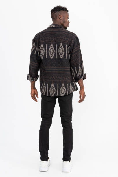 istock Black man wearing winter shirt against white background. 1447330451