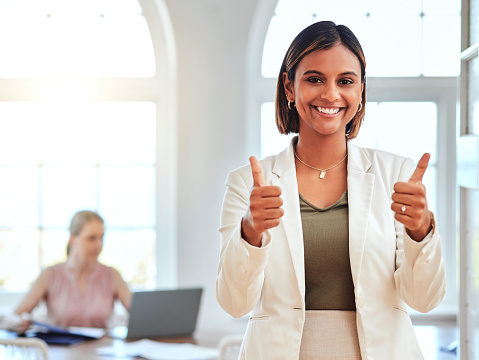 Thumbs up, businesswoman portrait and manager success, support and trust in modern office. Happy female leader celebrate win, motivation and thank you feedback for goal, like emoji and yes sign hands