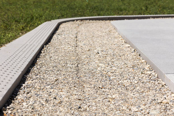 istock Drainage Gravel Path along Sidewalk 1447332328