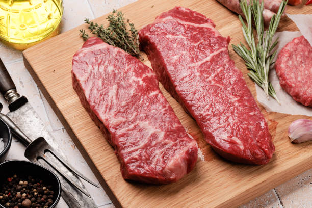 istock Prime marbled beef steaks. Raw striploin steak 1447338372