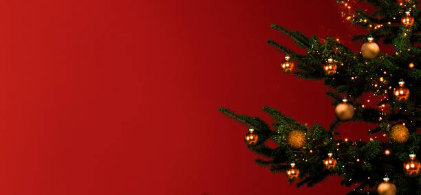 istock Christmas tree with golden balls on red background 1447338900