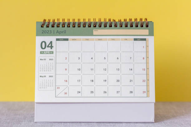 istock Hello April.Desktop calendar for April 2023 on the table. 1447339952