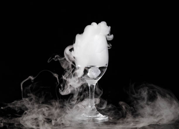 istock Dry ice bubbling up from the glass apparatus 1447340381