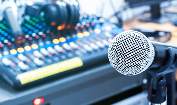 istock The microphone on tripod with mixer background in sound control room. 1447340568