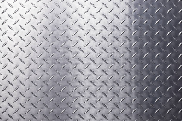 istock light metal surface, stainless steel plate with a diamond pattern. 1447341512