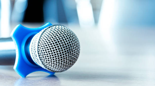 Close up microphone on table in seminar room. Close up microphone on table in seminar room. interview seminar microphone inside of stock pictures, royalty-free photos & images