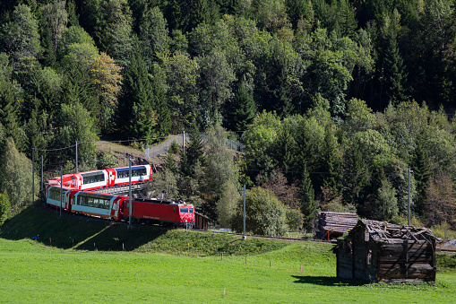 Glacier Express train at Fiesch (Valais, Switzerland). Railway between Sankt Moritz, Davos and Zermatt.