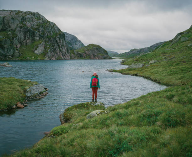 istock Woman hiking  in Norwegian highlands 1447351124