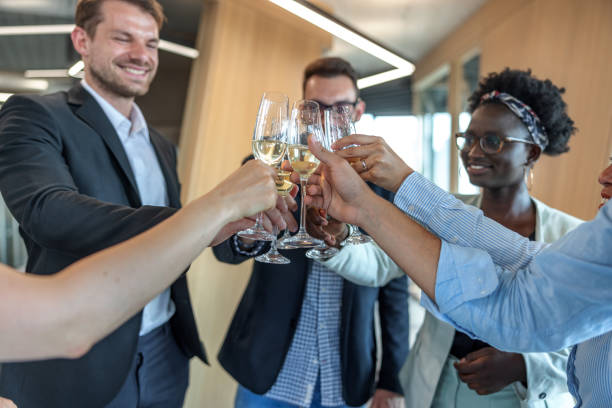 istock Creative Multiracial Marketing Team Toasting At The Office 1447352187